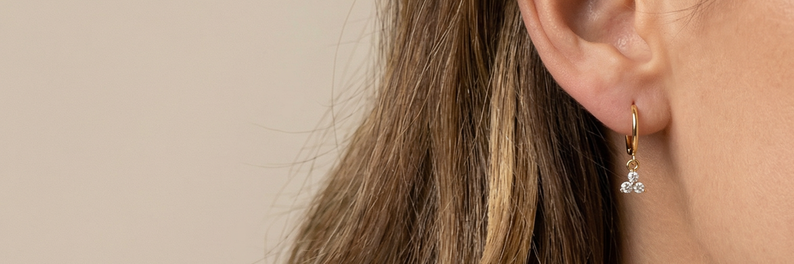 Gold Hoops & Huggie Earrings collection featuring timeless gold designs