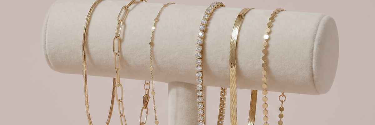 gold bracelets displayed on jewelry stand