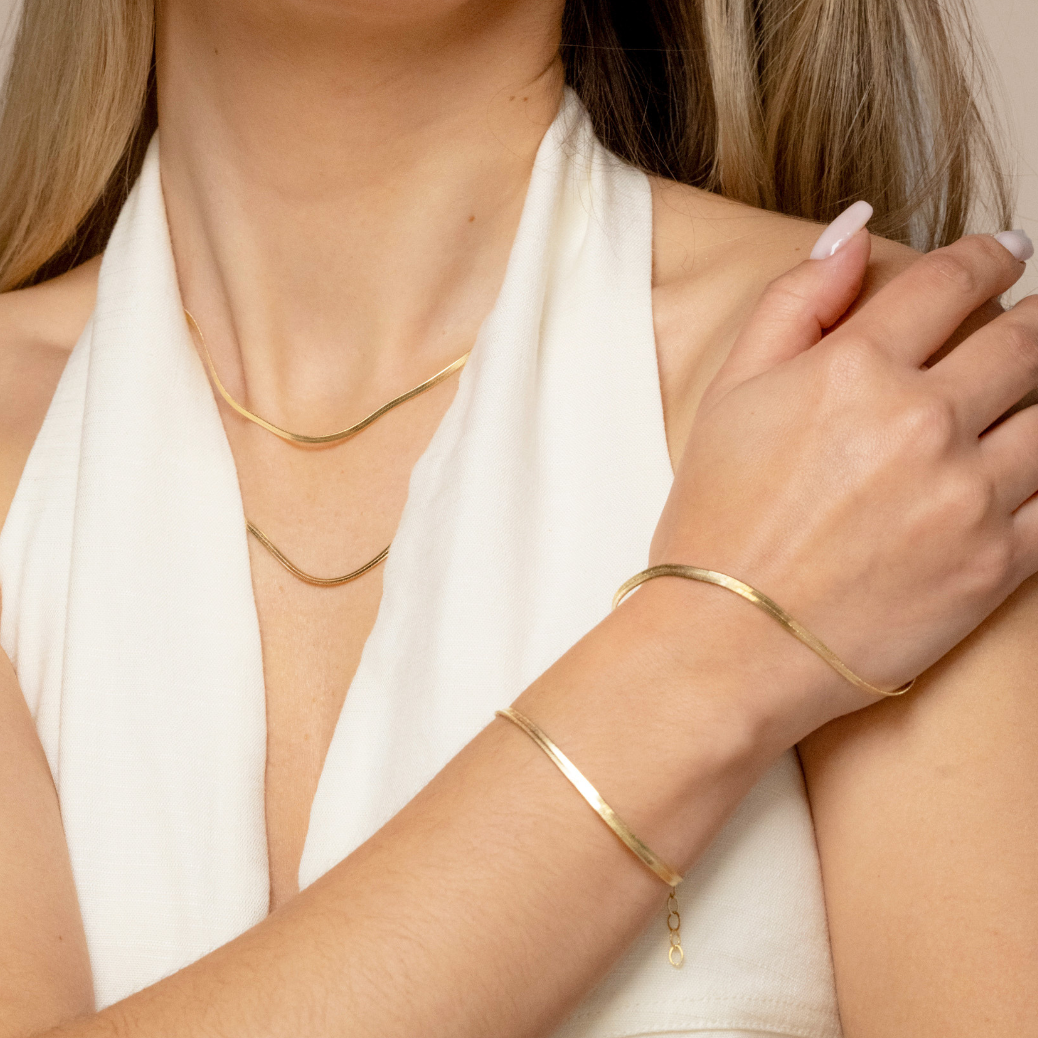 a women modeling a tarnish free gold bracelet