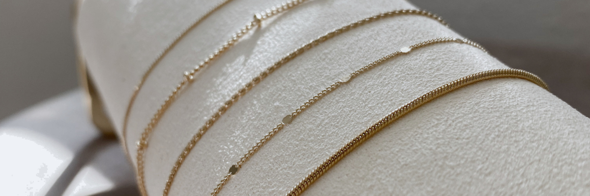 a women modeling a tarnish free gold bracelet