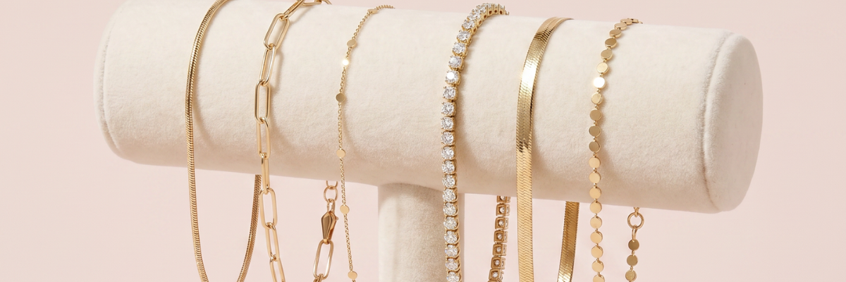 gold bracelets displayed on jewelry stand
