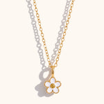gold necklace with white enamel daisy pendant