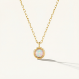 14k Solid Gold necklace with a pendant featuring an opal stone on a white background