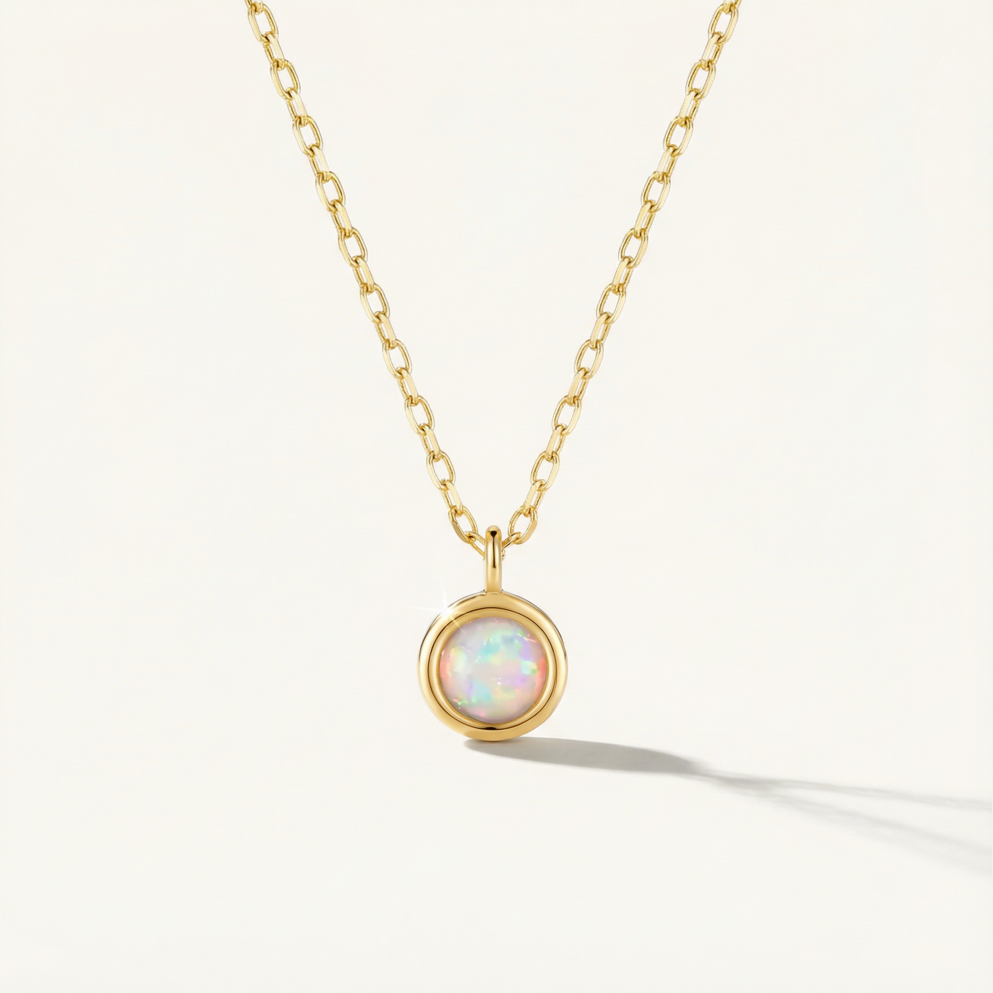 14k Solid Gold necklace with a pendant featuring an opal stone on a white background