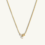Gold necklace with a pendant on a white background