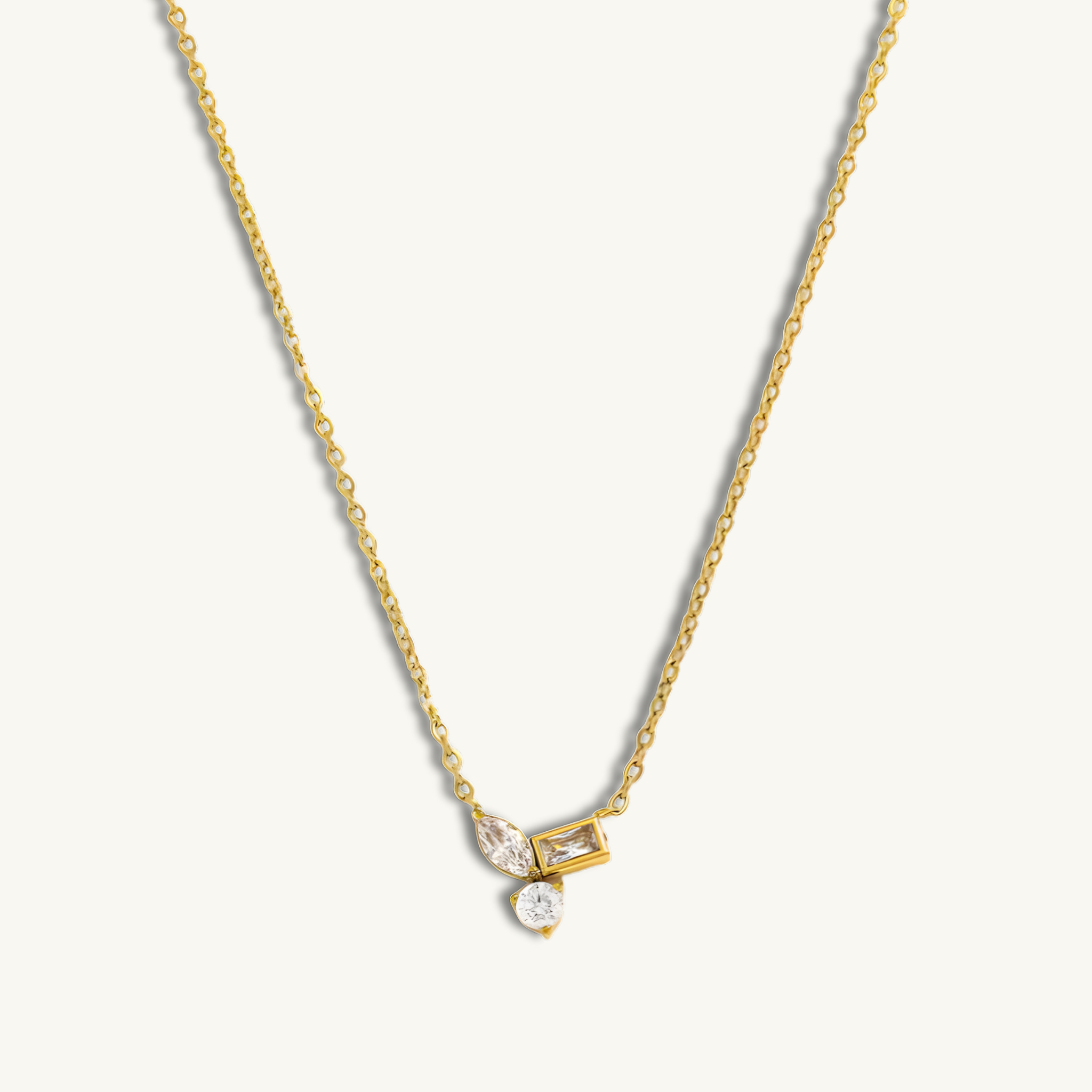 Gold necklace with a pendant on a white background