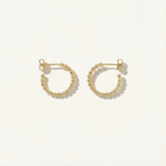 Gold hoop earrings on a white background