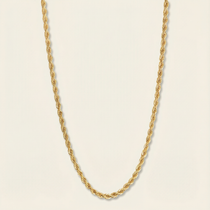 Gold rope chain necklace on a beige background