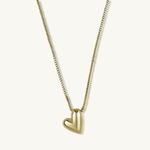 Gold heart-shaped pendant necklace on a white background