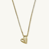 Gold heart-shaped pendant necklace on a white background