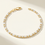 Gold tarnish free bracelet on a beige background