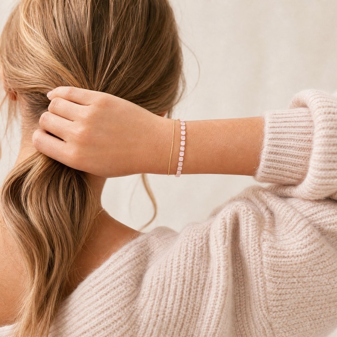 pink tennis bracelet worn by a women