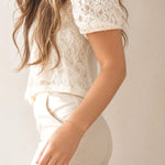 Woman in a neutral lace top and pants wearing the Figaro Bracelet, a gold filled chain bracelet by Kate Gates Jewelry