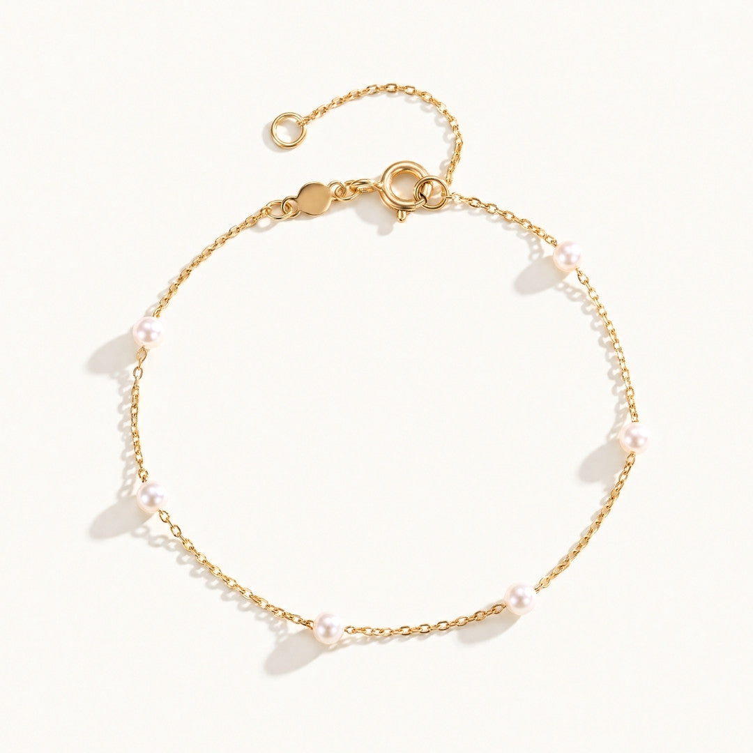 Ivy Gold Pearl Bracelet featuring freshwater pearl stations on a dainty gold chain by Kate Gates Jewelry