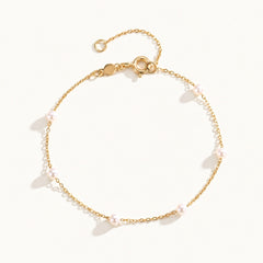 Ivy Gold Pearl Bracelet featuring freshwater pearl stations on a dainty gold chain by Kate Gates Jewelry